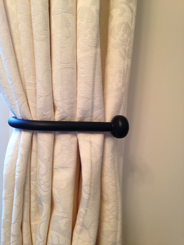 A Pair of Black Wrought Iron Metal Tie Backs with Button Stopper Ends 